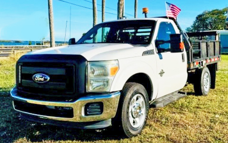 2012 FORD F250 4X4 W/8’ CM FLATBED