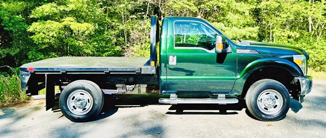 2012 FORD F250 4X4 W/8’ CM FLATBED 2012 FORD F250 4X4 W/8’ CM FLATBED
